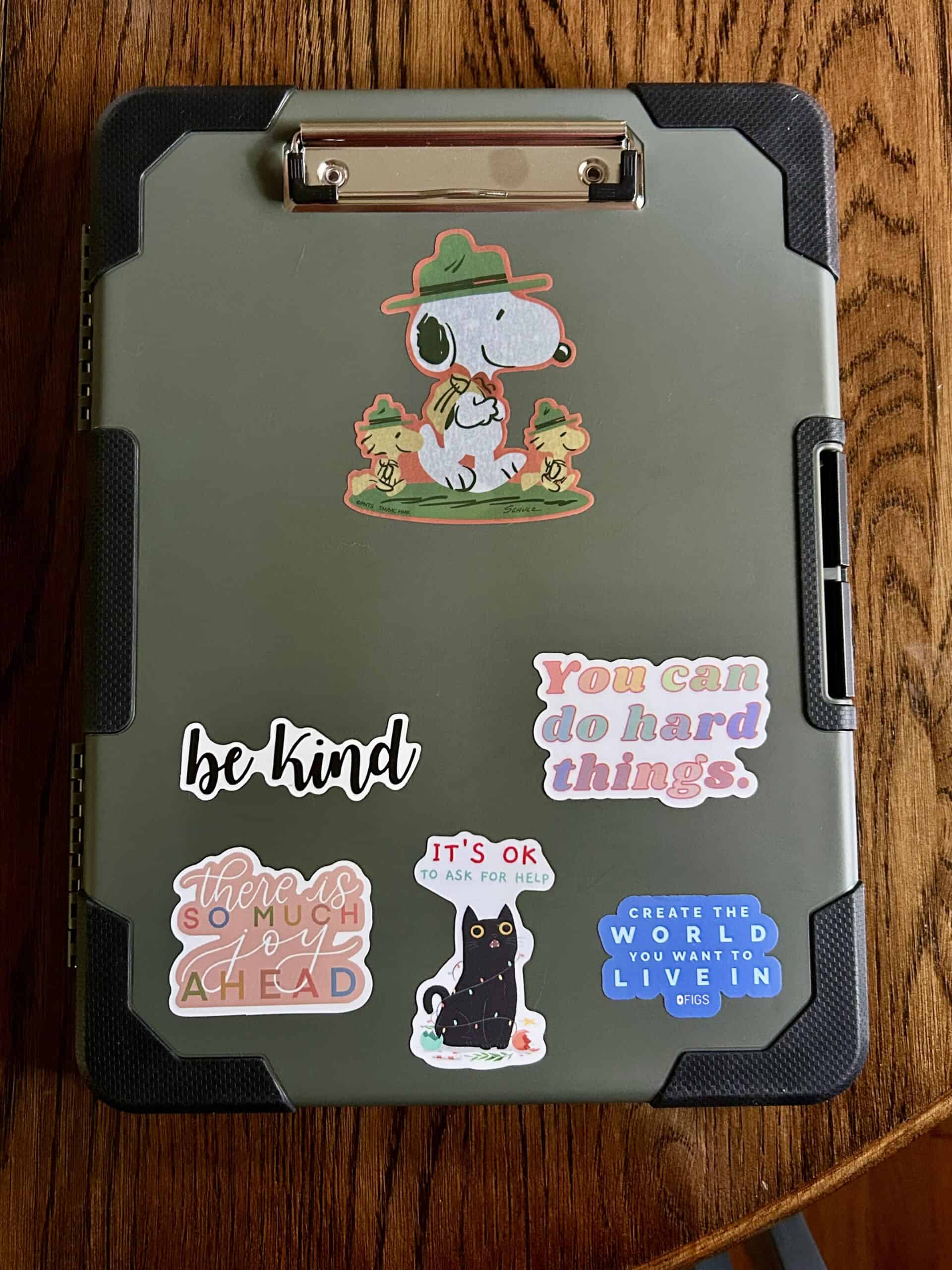 clipboard with stickers.
