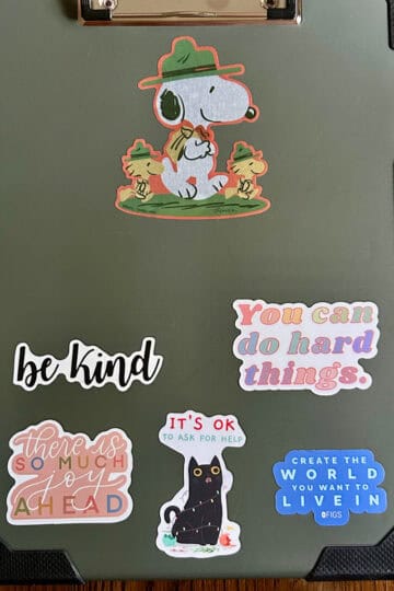 clipboard with stickers.