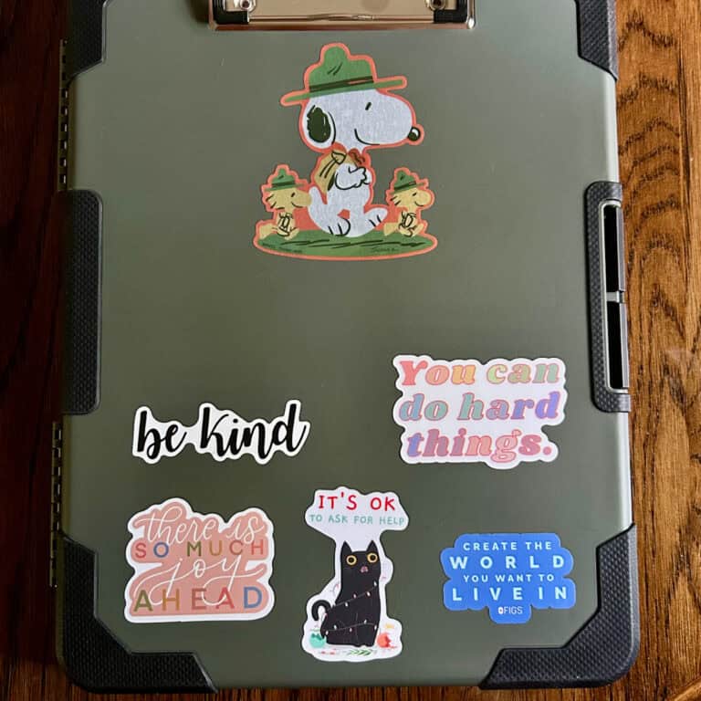 clipboard with stickers.
