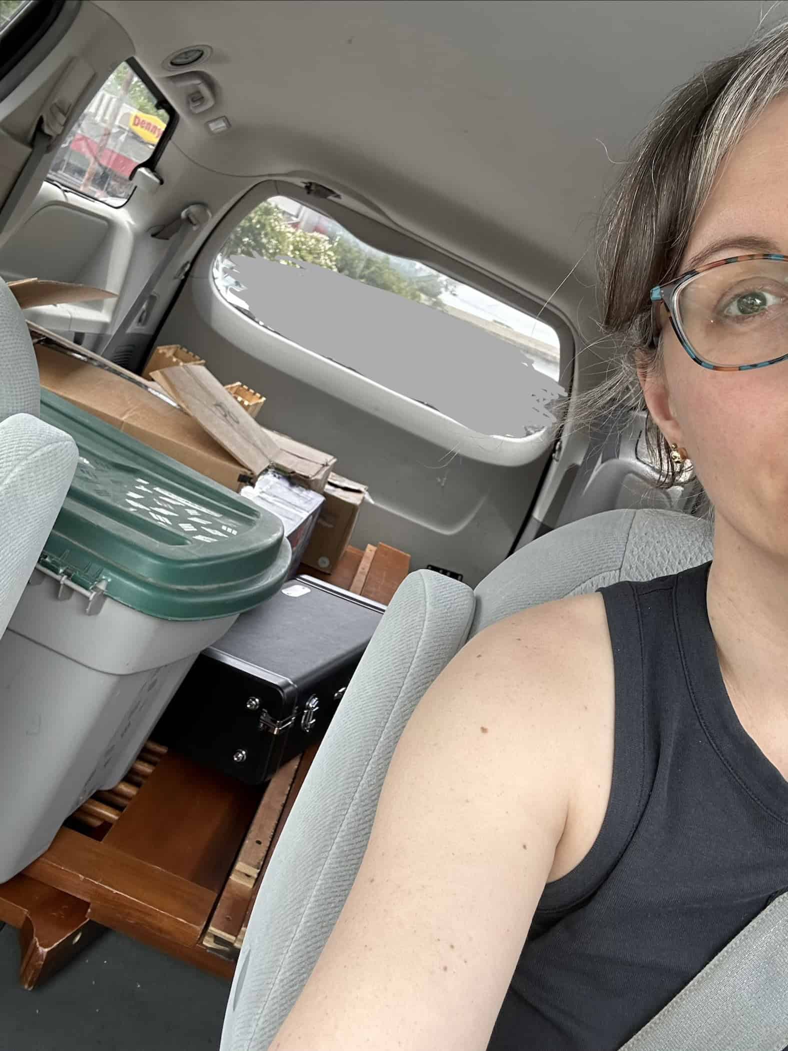 Kristen in a packed van.