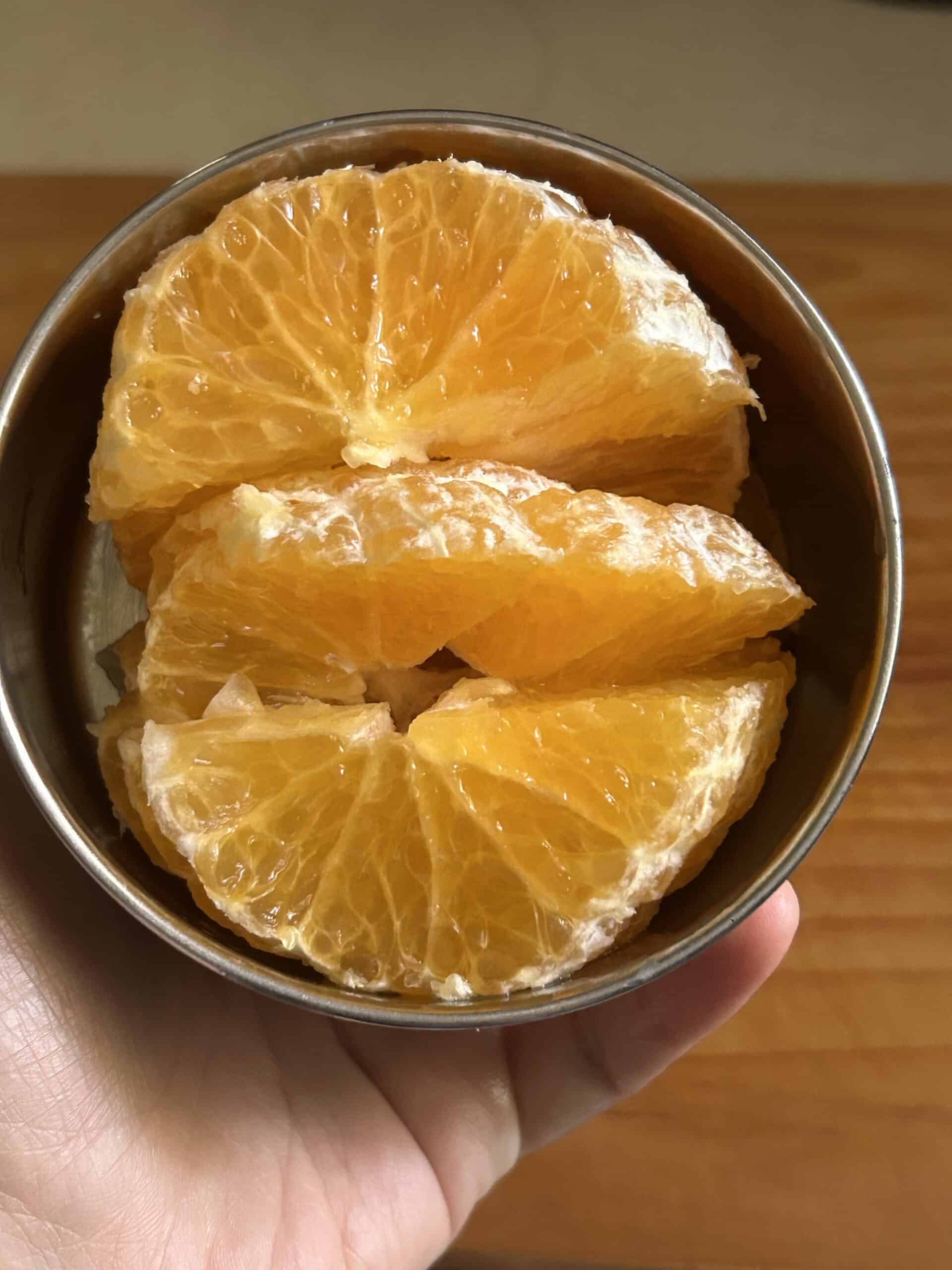 oranges in a metal container.