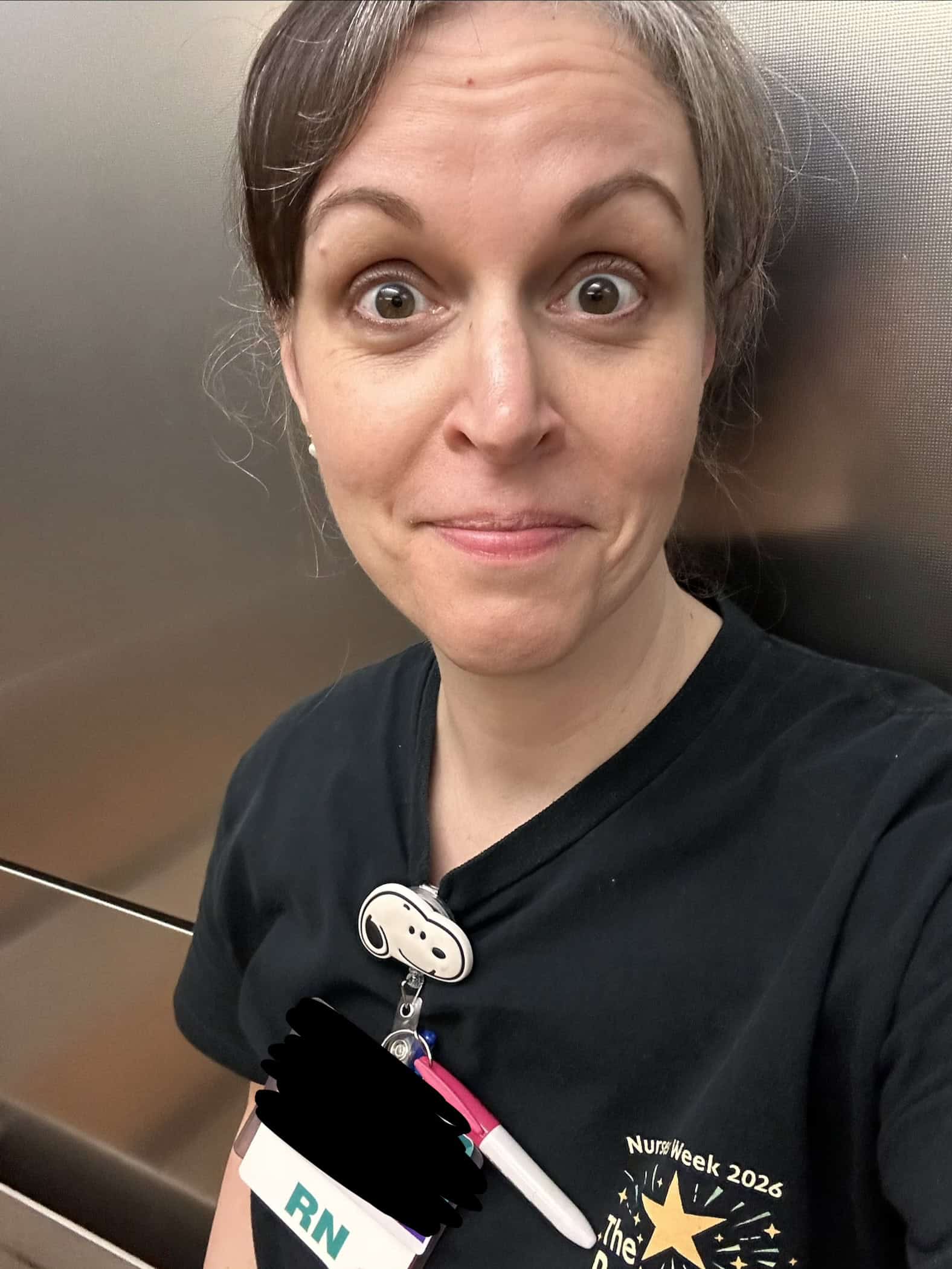 Kristen at work in an elevator.