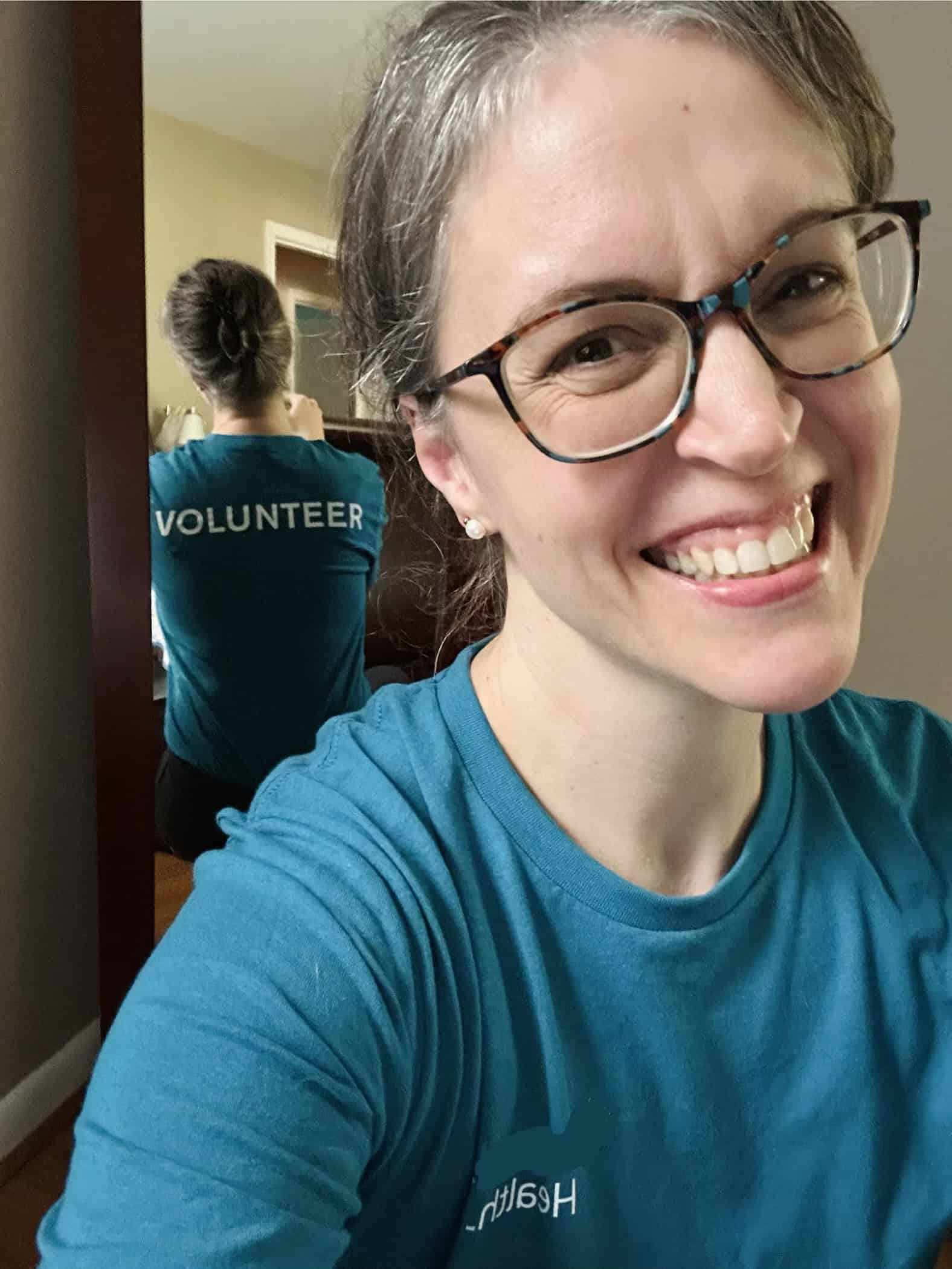 Kristen in a volunteer shirt.