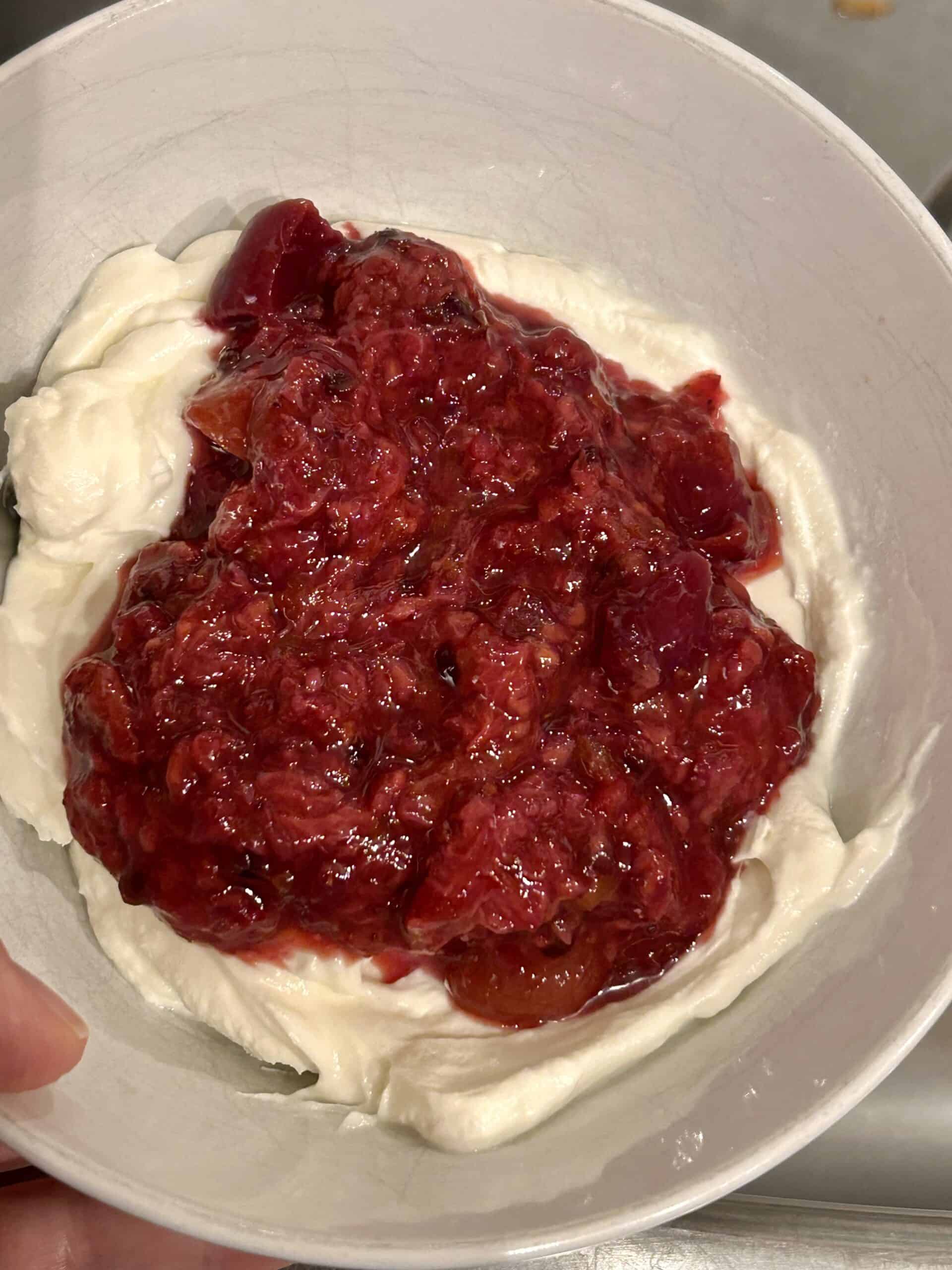 cooked fruit on top of yogurt.